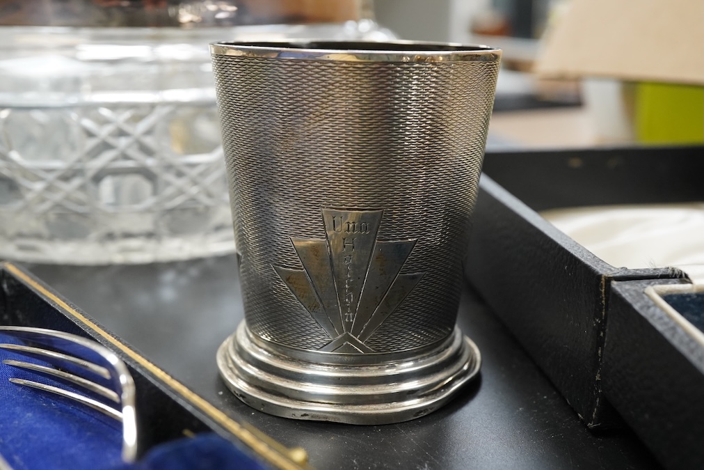 A silver christening mug, Birmingham, together with three cased sets, silver rimmed cut glass bowl, plated cocktail shaker etc